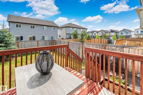 Expansive multi-level wood deck featuring a rich red-brown stain and sturdy railings - 249 39A Avenue, Edmonton, AB - Outdoor With Deck Patio Veranda With Exterior