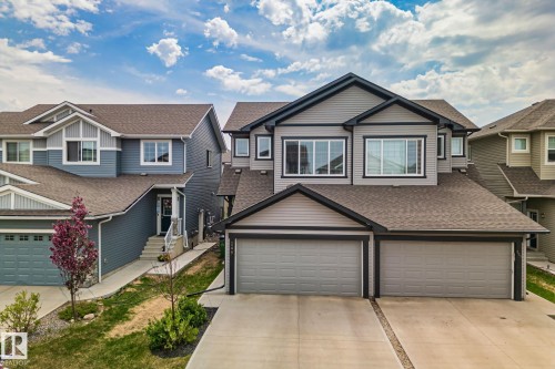 Modern two-story residence with a gray siding exterior and contrasting dark trim - 249 39A Avenue, Edmonton, AB - Outdoor With Facade