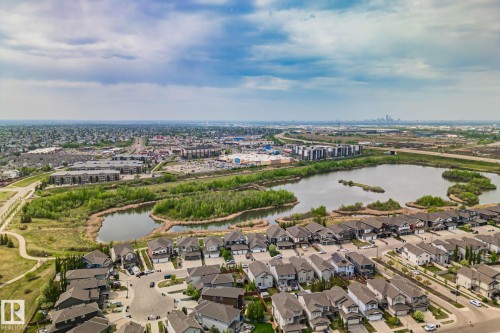 Aerial perspective featuring residential homes bordering a natural water body with green spaces - 249 39A Avenue, Edmonton, AB - Outdoor With View