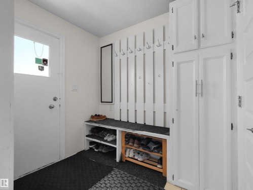 Entryway featuring integrated storage solutions - 15603 122 Street Nw, Edmonton, AB - Indoor Photo Showing Other Room