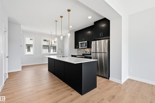 #4 11910 35 Av Sw, Edmonton, AB - Indoor Photo Showing Kitchen With Stainless Steel Kitchen With Upgraded Kitchen
