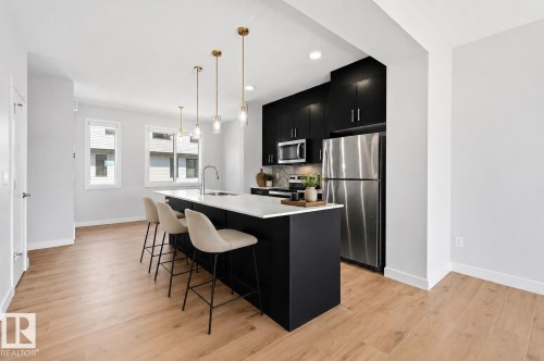 Virtually staged - #4 11910 35 Av Sw, Edmonton, AB - Indoor Photo Showing Kitchen With Stainless Steel Kitchen With Upgraded Kitchen