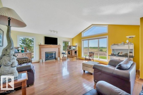 51111 Rr 233, Rural Strathcona County, AB - Indoor Photo Showing Living Room With Fireplace