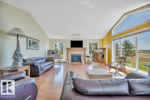 51111 Rr 233, Rural Strathcona County, AB - Indoor Photo Showing Living Room With Fireplace