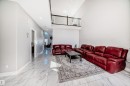 Two-story living area featuring high ceilings and an open balcony overlooking the space - 2464 15 Avenue Nw, Edmonton, AB  - Indoor 
