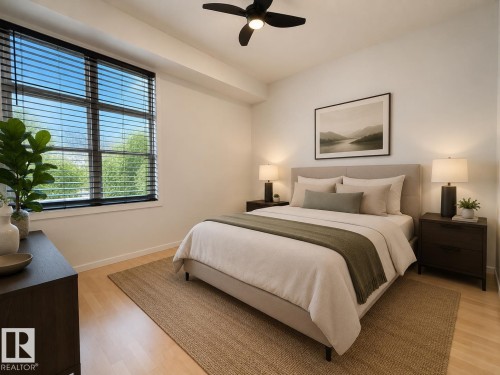 Bedroom featuring a large window with horizontal blinds, a ceiling fan, and wood-finish flooring - #412 9503 101 Av Nw, Edmonton, AB - Indoor Photo Showing Bedroom