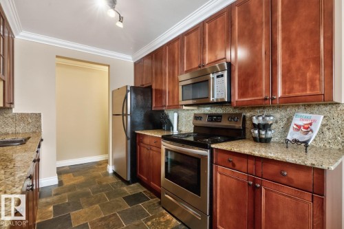 #206 10745 83 Av Nw, Edmonton, AB - Indoor Photo Showing Kitchen With Stainless Steel Kitchen