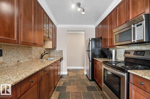 #206 10745 83 Av Nw, Edmonton, AB - Indoor Photo Showing Kitchen With Stainless Steel Kitchen