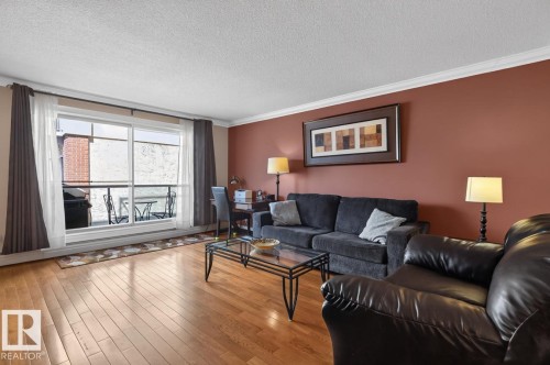 #206 10745 83 Av Nw, Edmonton, AB - Indoor Photo Showing Living Room