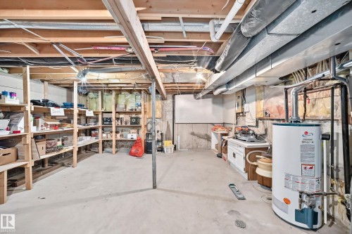 Unfinished basement featuring exposed ceiling joists and concrete flooring - 1116 39 Street Nw, Edmonton, AB - Indoor Photo Showing Basement