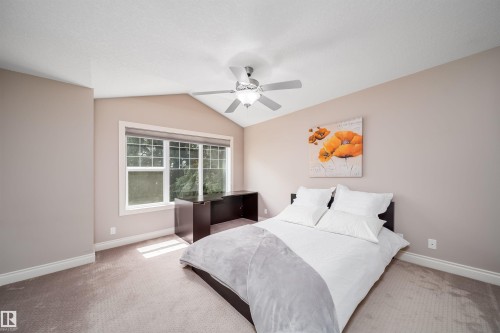 Bedroom featuring a vaulted ceiling and a ceiling fan - 11342 79 Avenue, Edmonton, AB - Indoor Photo Showing Bedroom
