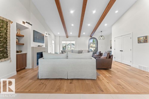 Vaulted ceilings with exposed wood beams define this living space - 2503 Lockhart Way, Cold Lake, AB - Indoor