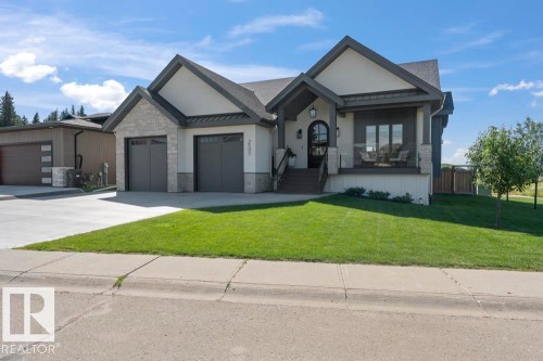 Contemporary single-story residence with a stone and stucco exterior - 2503 Lockhart Way, Cold Lake, AB - Outdoor With Facade