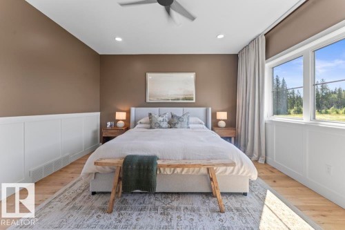 Spacious room featuring wood-finish flooring, recessed lighting, and a contemporary ceiling fan - 2503 Lockhart Way, Cold Lake, AB - Indoor Photo Showing Bedroom