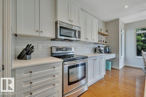 313 Southwick Boulevard, Leduc, AB - Indoor Photo Showing Kitchen With Stainless Steel Kitchen With Upgraded Kitchen