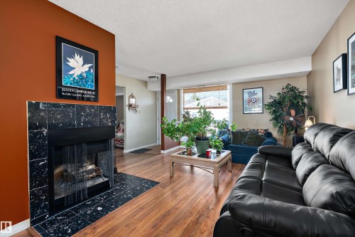 #64 2204 118 St Nw, Edmonton, AB - Indoor Photo Showing Living Room With Fireplace