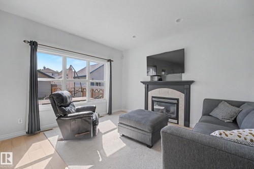 5079 Thibault Way Nw, Edmonton, AB - Indoor Photo Showing Living Room With Fireplace