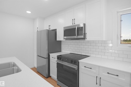 2708 Alces Way Sw, Edmonton, AB - Indoor Photo Showing Kitchen With Double Sink