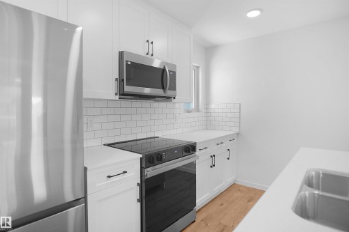 2708 Alces Way Sw, Edmonton, AB - Indoor Photo Showing Kitchen With Double Sink With Upgraded Kitchen