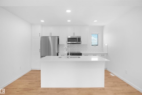 2708 Alces Way Sw, Edmonton, AB - Indoor Photo Showing Kitchen With Double Sink With Upgraded Kitchen