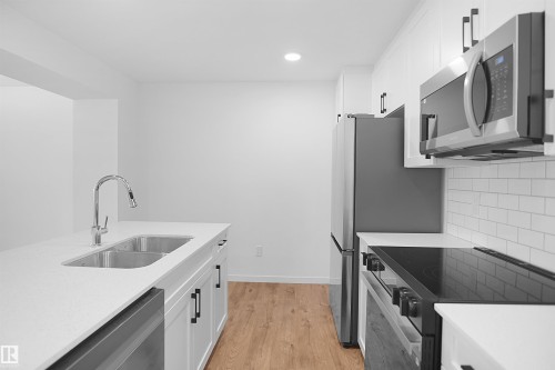 2708 Alces Way Sw, Edmonton, AB - Indoor Photo Showing Kitchen With Double Sink With Upgraded Kitchen