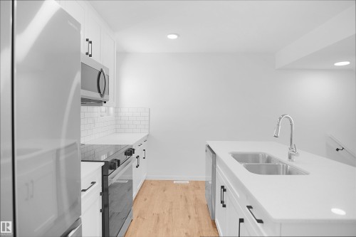 2708 Alces Way Sw, Edmonton, AB - Indoor Photo Showing Kitchen With Double Sink With Upgraded Kitchen