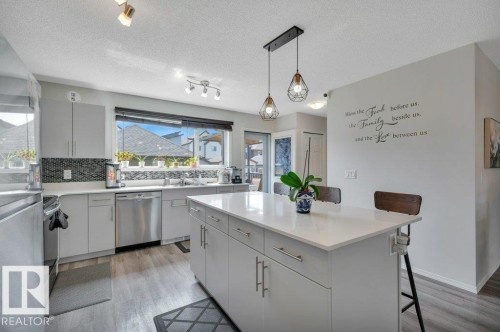 Bright open kitchen with large island - 19303 27 Avenue Nw, Edmonton, AB - Indoor Photo Showing Kitchen