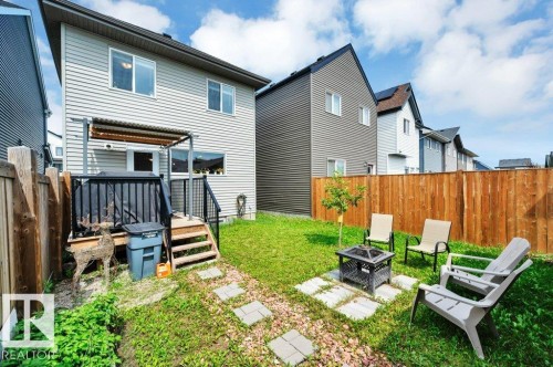 Back yard, with covered deck and fire pit - 19303 27 Avenue Nw, Edmonton, AB - Outdoor