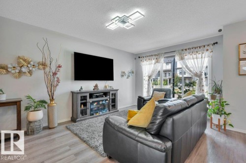 Open concept layout - 19303 27 Avenue Nw, Edmonton, AB - Indoor Photo Showing Living Room