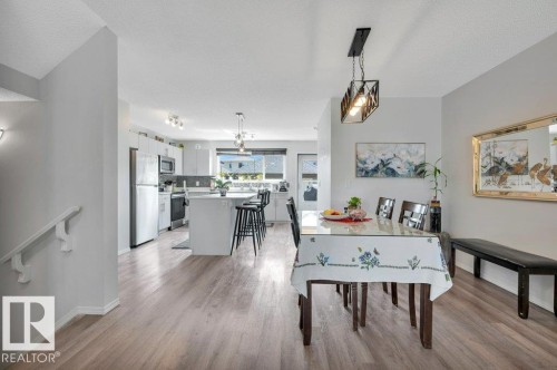 Large dining nook looking into kitchen - 19303 27 Avenue Nw, Edmonton, AB - Indoor