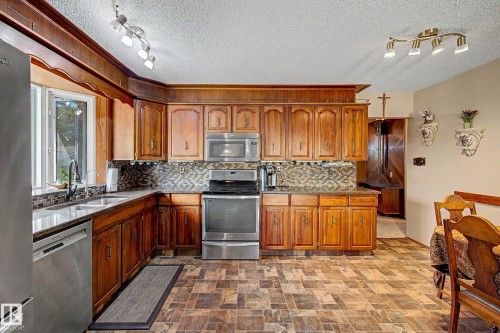 6115 152A Avenue Nw, Edmonton, AB - Indoor Photo Showing Kitchen With Double Sink