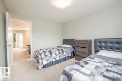 Spacious room with light-colored carpeting and neutral wall tones - 