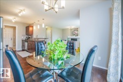 Open-concept dining area with wood-finish flooring - 