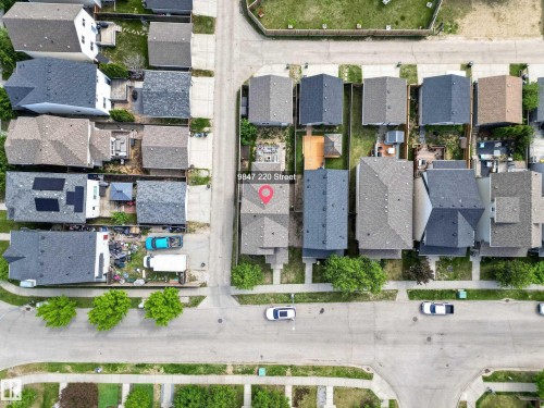 Aerial perspective showcasing a residential neighborhood with varied rooflines and established street trees - 9847 220 Street Nw, Edmonton, AB - Outdoor With View
