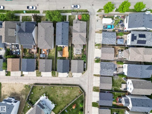 Aerial perspective showcasing a residential neighborhood with a grid street pattern - 9847 220 Street Nw, Edmonton, AB - Outdoor