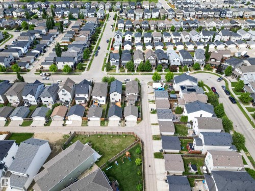 Aerial perspective of a residential neighborhood featuring detached homes with varied rooflines and asphalt shingles - 9847 220 Street Nw, Edmonton, AB - Outdoor With View