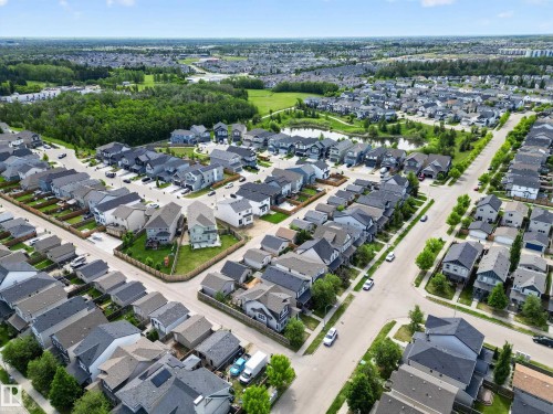 Expansive aerial view of a residential development featuring numerous single-family homes with varying architectural styles - 9847 220 Street Nw, Edmonton, AB - Outdoor With View