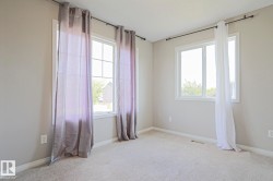 Neutral tone walls with soft carpet flooring - 