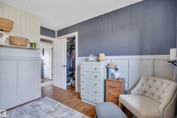 Wood-finish flooring throughout, complemented by a board and batten wall treatment - 