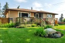 Exterior with horizontal siding and stone accents - 5302 52 Ave, Wetaskiwin, AB  - Outdoor 