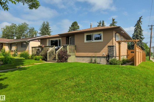 Single-story residence featuring light brown siding and stone veneer accents - 5302 52 Ave, Wetaskiwin, AB - Outdoor