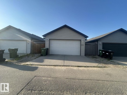 Double Oversized Garage with storage in attic. - 259 Robinson Drive, Leduc, AB - Outdoor With Exterior