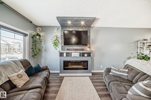 259 Robinson Drive, Leduc, AB - Indoor Photo Showing Living Room With Fireplace