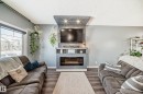 259 Robinson Drive, Leduc, AB  - Indoor Photo Showing Living Room With Fireplace 