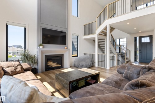 6 Harrow Close, Ardrossan, AB - Indoor Photo Showing Living Room With Fireplace