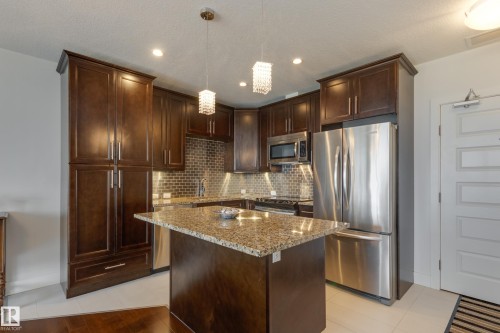 #403 1350 Windermere Wy Sw, Edmonton, AB - Indoor Photo Showing Kitchen With Stainless Steel Kitchen With Upgraded Kitchen
