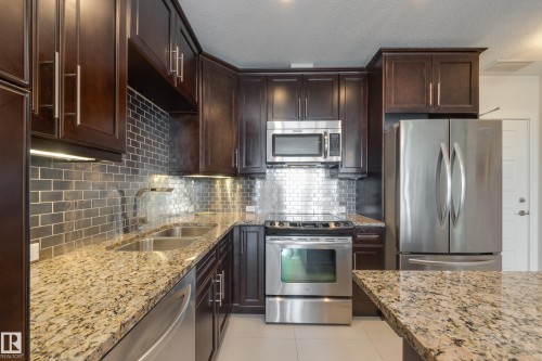 #403 1350 Windermere Wy Sw, Edmonton, AB - Indoor Photo Showing Kitchen With Stainless Steel Kitchen With Double Sink With Upgraded Kitchen