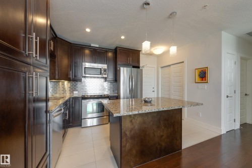 #403 1350 Windermere Wy Sw, Edmonton, AB - Indoor Photo Showing Kitchen With Stainless Steel Kitchen With Upgraded Kitchen