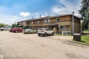 Two-story townhome featuring a brown and beige exterior with multiple windows - 155 Woodborough Way Nw, Edmonton, AB  - Outdoor 