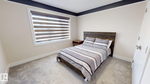 5813 Pelerin Crescent, Beaumont, AB - Indoor Photo Showing Bedroom